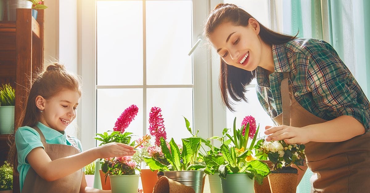 A mother and daughter celebrate the earth in their energy efficient home. Norfleet builds energy efficient homes because we believe in protecting our environment.