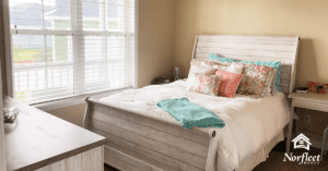 Pictured here is a bedroom in a Norfleet home. Norfleet builds luxury custom homes in Newberry, High Springs, and Gainesville, Florida.